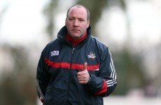 Why is Cork's football manager so keen to release players for club matches?