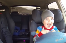 Kid experiences pure joy while taking a ride in a drift car
