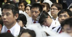 PICS: 2,500 couples marry, take selfies and nap at South Korean mass wedding