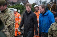 Princes pitch in as British floods leave at least two dead