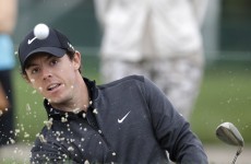 McIlroy clings to PGA lead while Tiger makes cut