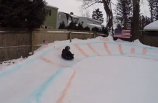 Best dad ever builds massive snow luge in back garden