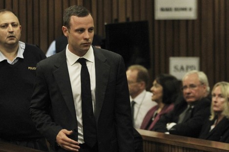 Pistorius arrives for his trial at the high court in Pretoria this morning. 