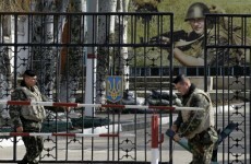 Russian troops and planes flow into Crimea as EU says sanctions are on the table