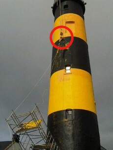 Man left dangling from lighthouse after scaffolding collapse