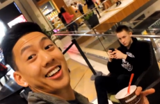 Guy runs around shopping centre taking suprise selfies with strangers