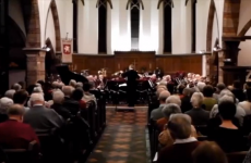 Man sneezes into his trombone during concert