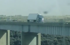 Huge lorry gets blown over while crossing bridge