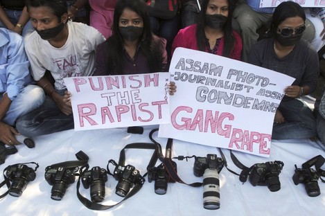 Photojournalists during a protest over the gang rape of the 22-year-old in Mumbai