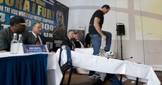 Tyson Fury shows he's really fired up for his next fight by flipping a table at a press conference
