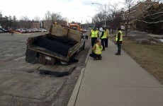 Unfortunate pothole-filling crew manage to get stuck in giant pothole