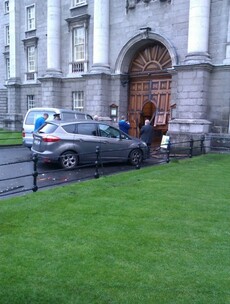 Car driven by 68-year-old crashes into the front gate of Trinity College