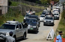 Pakistan's former ruler survives after bomb explodes just before his convoy passed