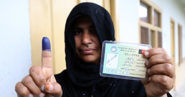 Afghan voters brave Taliban threats in historic election