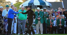 Jack Nicklaus and Gary Player fist bump to get the Masters underway