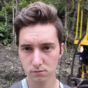 Man attempts to a take selfie with a passing train