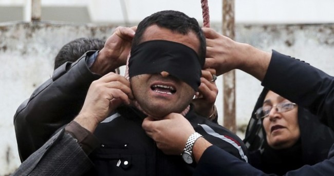 Photos: Mother stops execution as her son's killer was about to be hanged