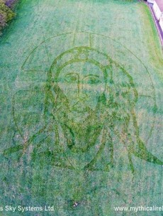No, it's not an Easter apparition. This face of Jesus in a field in Drogheda is art