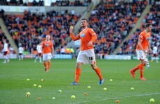 Blackpool fans throw 200 tennis balls and tangerines onto the pitch