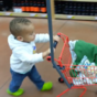 Dad takes toddler shopping for food. Toddler has other plans.