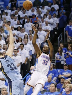 Kevin Durant nails an incredible four-pointer while falling backwards off the court