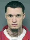 Man with 'MURDER' tattooed on his neck is now on trial for murder...and wants the tattoo removed