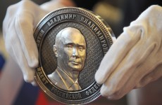 Putin's face appears on coin marking Crimea's annexation