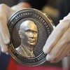 Putin's face appears on coin marking Crimea's annexation