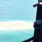 Stranded snorkellers saved after writing huge SOS in the sand