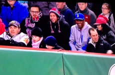 Evil baseball watcher poaches ball from grasp of young Yankees fan