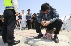 Race to recover bodies from Korea ferry before storms hit