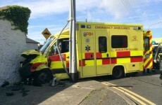 Crew injured after ambulance crashes into wall