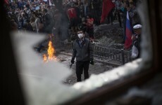 Military conscription introduced in Ukraine as petrol bombers take over more buildings