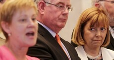 Standing beside Eamon Gilmore, Phil Prendergast says she still wants him to resign
