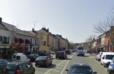 Red balaclava-wearing raider threatens supermarket staff