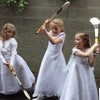 Young GAA stars can't part with their hurleys on Communion day