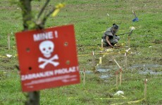 Floods unearth land mines in Bosnia - and wash away warning signs