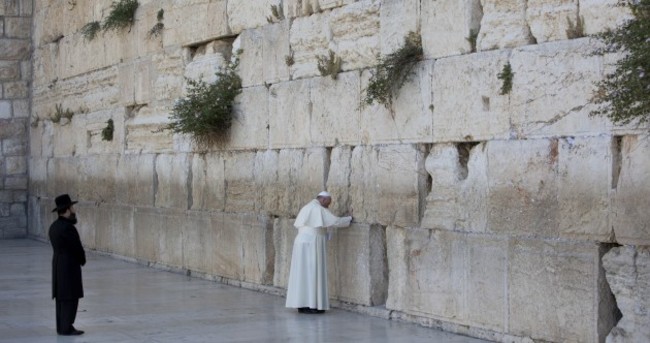 Pope Francis made an unexpected stop at the Western Wall to pray and leave a note