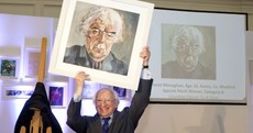 Here's President Higgins looking quite pleased with a new painting he was given
