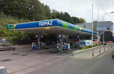 Two men charged over filling station robbery