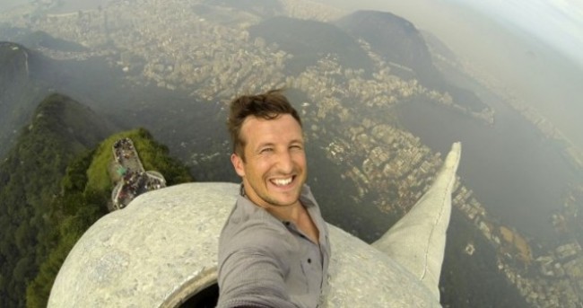 Guy takes the ultimate selfie atop Brazil's Christ The Redeemer statue