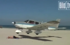 Sunbather has incredible near-miss with low-flying plane (video)