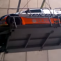 Argh! Rally car rolls off platform while being transported by a crane