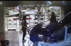 This woman hasn't a clue how to ride an escalator