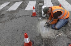 A man is filling Chicago's potholes with wonderful mosaics
