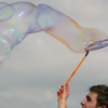Giant bubbles bursting in slow motion are mesmerising