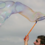Giant bubbles bursting in slow motion are mesmerising