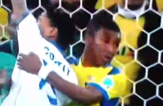 Referee somehow waves play on as Costly is rugby tackled in the box