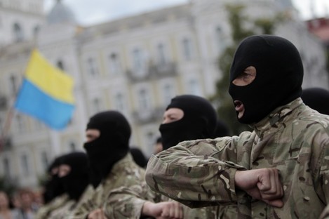 Volunteers take an oath of allegiance to Ukraine, before being sent to the eastern part of Ukraine to join the ranks of special battalion "Azov" in Kiev,.
