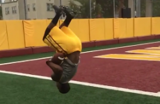 Wide receiver catches two footballs while doing a backflip